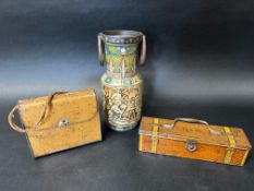 Three Huntley & Palmers Ltd. novelty biscuit tins, one in the form of a leather handbag, a toolkit
