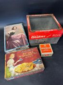 Four biscuit tins including a Weston's glass topped counter dispenser, a Crawford's 4 O'Clock