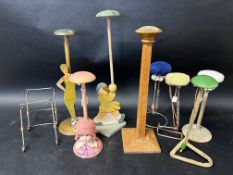 A quantity of shop display stands, mostly for hats, some good early examples.