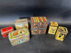 Six novelty biscuit tins including a Huntley & Palmers book case of good strong colour, three Carr's