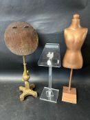 Two adjustable shop display shoe stands and a small mannequin.