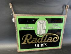A rare Radiac Shirts double sided reverse painted glass advertising sign set within metal hanging