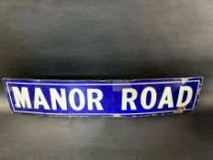 An Edwardian enamel road sign for Manor Road, 34 x 7