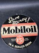 A Mobiloil 'in a sealed drum' price indicator per quart circular tin advertising sign, 10 1/4