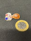 A Regent TT enamel badge illustrating Regent Petrol's 1950s advertising campaign TT Packs Punch!