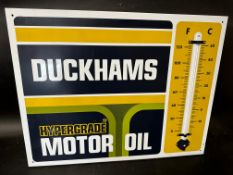 A Duckhams Hypergrade Motor Oil garage enamel advertising thermometer sign, 26 1/4 x 20