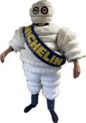 A Mr. Bibendum promotional suit comprising a body, head, arms, legs, boots, sash and large vinyl