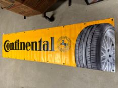 A Continental (tyres) vinyl garage advertising banner, appears unused, 98 1/4 x 23