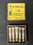 A late 1920s Michelin 'Lucrative' valve tin depicting Mr. Bibendum smoking a cigar, with full set of