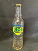 A Duckham's NOL Motor Oils glass oil bottle with Duckham's 20 cap.