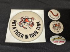 A selection of Esso tiger promotional items including a 'Put a Tiger in Your Tank' car sticker and