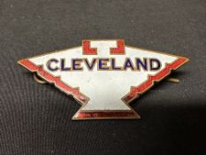 A Cleveland (petrol) enamel cap badge, 5 1/2 x 2 3/4cm.