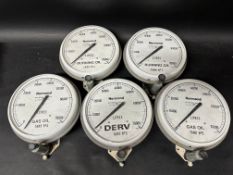 Five Normond of Richmond tank guages labelled Burning Oil x 2, Gas Oil x 2 and Derv, Tank numbers