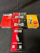 Two boxes of new old stock Champion Spark Plugs, a box of new old stock Unipart spark plugs, a box