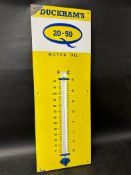 A Duckham's 20-50 enamel garage advertising thermometer, 13 x 36