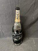 An empty jeroboam of Moet & Chandon champagne signed by World Champion Racing Driver Jackie Stewart.