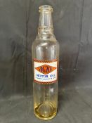 A Vigzol Motor Oil glass oil bottle.