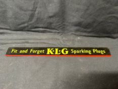 A K.L.G 'Fit and Forget' Sparking Plugs advertising shelf strip sign, 15 1/2