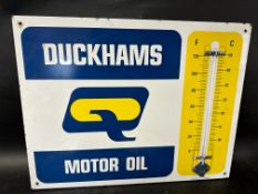 A Duckhams Motor Oil garage enamel advertising thermometer sign by Burnham, 26 1/2 x 20 1/4