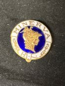 A Minerva (motor cars) enamel badge depicting the head of Minerva, the Roman goddess of wisdom,