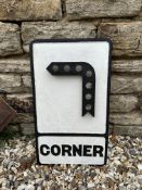 A cast iron 'Corner' raised corner symbol road sign with original reflectors, 12 x 20 1/2