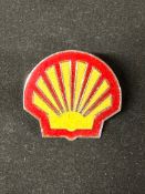 A Shell enamel cap badge, 4 x 4cm.