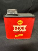 A Shell X-100 Motor Oil 20/20w one pint can.