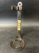 A Mobiloil 'Quart Can Clip', wall mounted holder with labels to either side of neck advertising