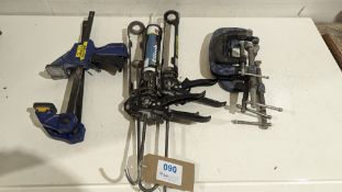 Various clamps and silicone guns as lotted
