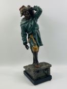 Spelter figure of a man signed Henry Weisse