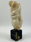 Resin figure of a couple embracing