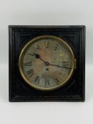 An antique square oak cased wall clock with a circular silvered dial