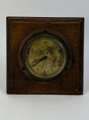 An early 20th century 8-day Swiss made bezel wound dashboard clock
