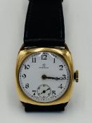 A gold plated 1930's cushion cased Omega gents wrist watch