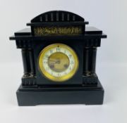 A late 19th century French slate mantel clock