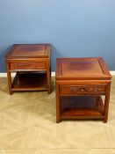 A pair of Chinese hardwood end tables