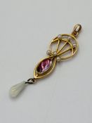 Yellow metal and pearl pendant