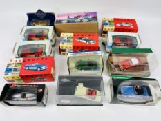 A collection of various branded boxed die cast toy cars