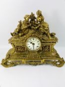 A 20th century French antique style Imperial cast brass mantel clock