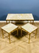 Mid-century nest of brass and onyx coffee tables