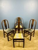 A set of four stained oak dining chairs