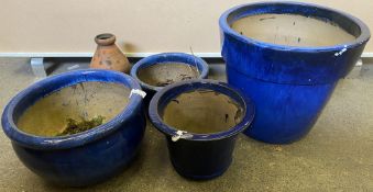 Collection of garden planters and pots