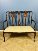 An Edwardian mahogany marquetry inlaid two seater chair back settee