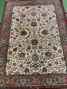 A red ground Middle Eastern style rug