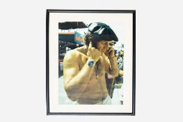 Colour Photograph of Steve McQueen in the Pits at Sebring Wearing His Rolex Submariner