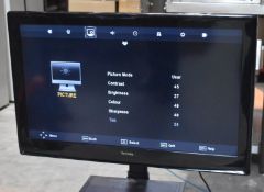 1 x Technika 32 Inch LCD Television With Mobile Stand - Includes the Base and Remote Control