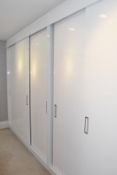 Bank of Luxury Fitted Bedroom Wardrobes with Gloss White Sliding Door Frontage, 4.7-Metres Wide