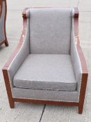 Pair of Stylish Upholstered Lounge Armchairs with Sweeping Curved Design and Studded Detail -