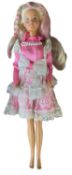Sindy in bright pink and lace dress, with beaded necklace and pink streaked hair (c1980s)
