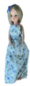 Second generation Sindy with short cropped hair in white and blue floral dress with blue hair bow,